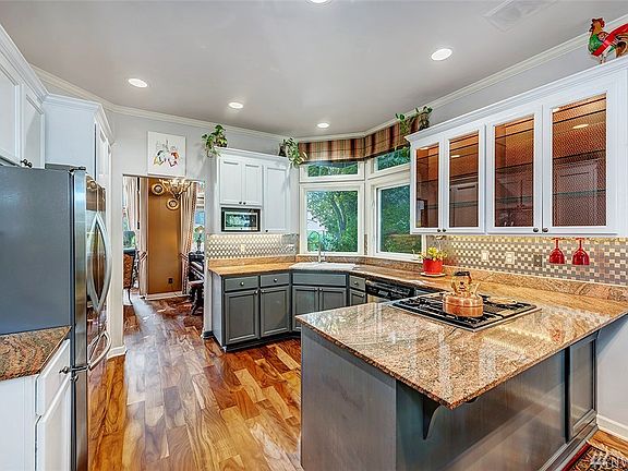 The Kitchen Has Been Recently Renovated With New Flooring, Granite Counter-Tops, Custom Cabinets, And High-End Stainless Steel Appliances.