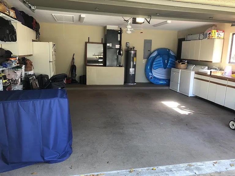 Two car garage with Laundry and cabinets. Two year old AC and WH units.