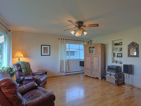 Living Room also has a ceiling fan and vintage cut-out cubby for pictures and display of other treas
