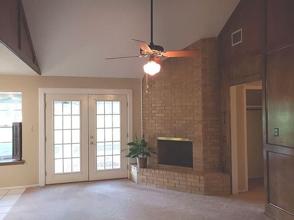 Family Room has Gas Log Fireplace, French Doors to Covered Patio...