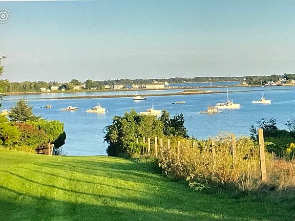 View of water access to Casco Bay from green space off of deck