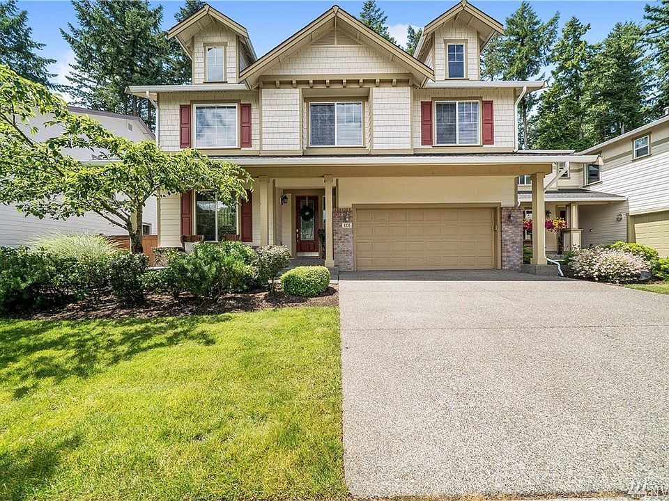 Front of home with adorable front porch and brick accents. HOA maintained front yard.