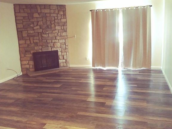 Living room with wood burning fireplace