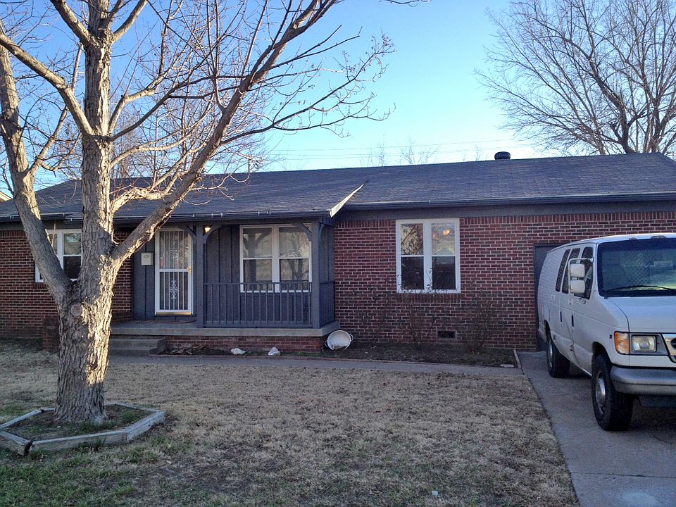Front with 1 car garage and front porch
