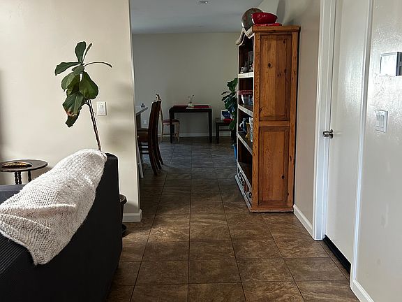 Open hall towards the kitchen. First entrance on the right is rented. Second door on the right is the available room for rent. Third door on the right is the shared bathroom.