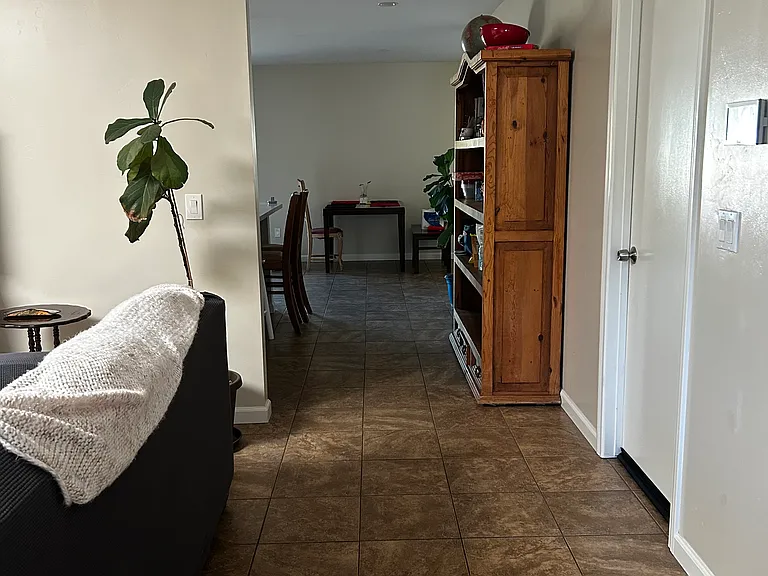 Open hall towards the kitchen. First entrance on the right is rented. Second door on the right is the available room for rent. Third door on the right is the shared bathroom.