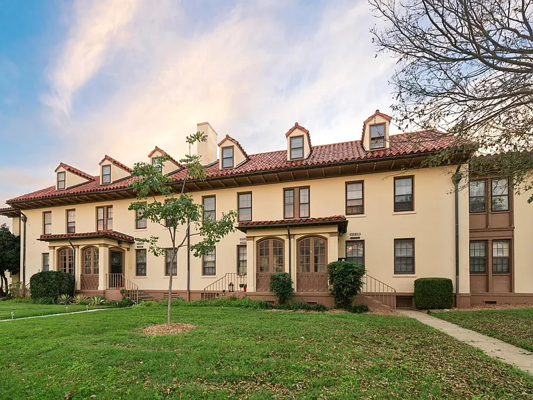 Academic Flats is a quad-plex, multi-level unit with individual front entry way doors.