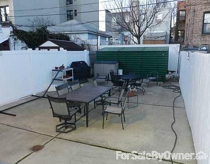 Side view of the house
						:
						Has three Bay style side windows