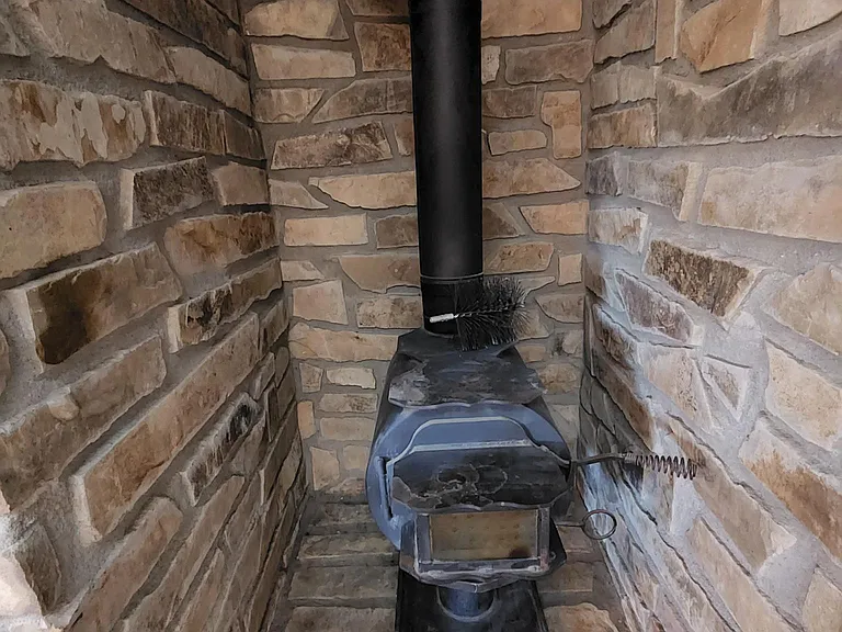 Lower level wood burning stove