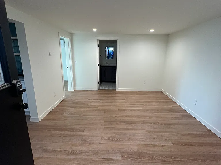 Sizeable living room with setup for wall mounting television.