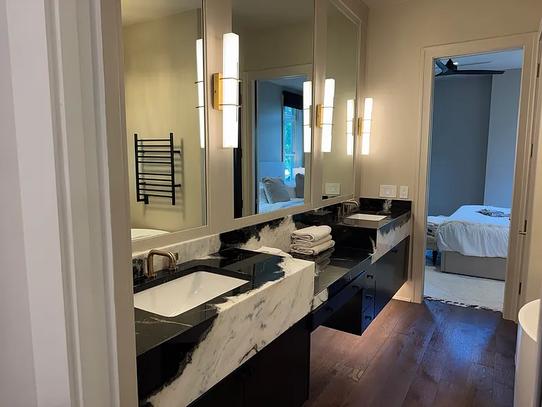 Heated wood floors with heated towel rack