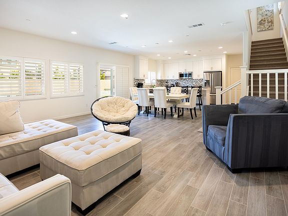 Main living room with view of the kitchen and dinning area