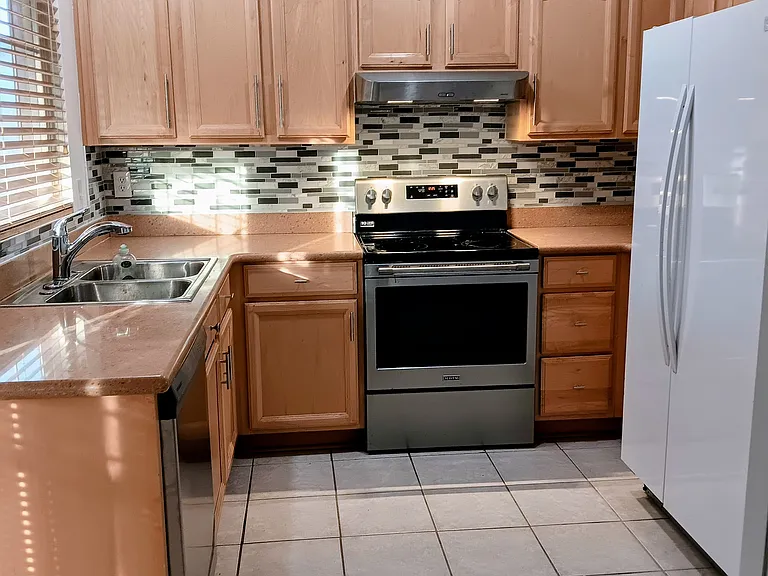 kitchen electric stove with oven double door refrigerator a dishwasher