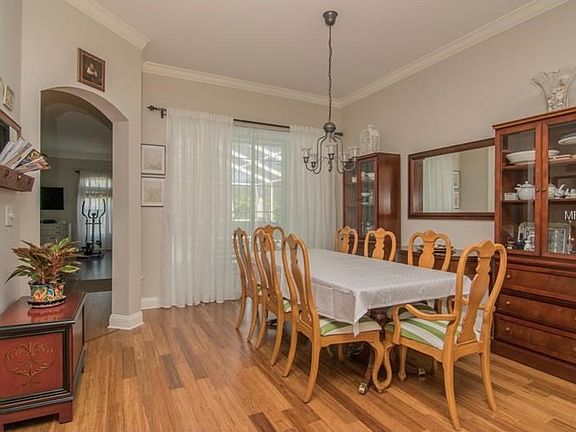 Dining Room with view to pool and kitchen/family room combo