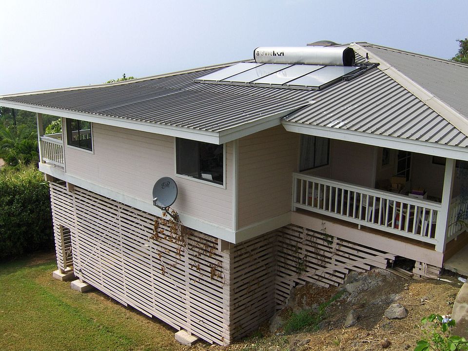 Entrance porch on right leads to 3BR/2BA single-level living area.