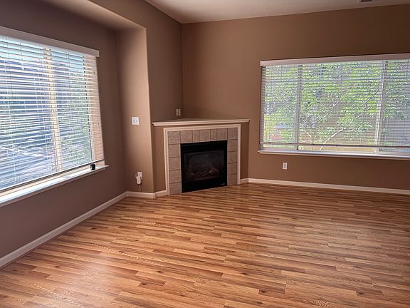 Large living room with gas fireplace. Pergo floors.