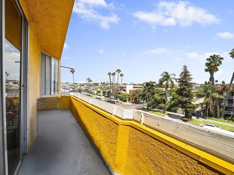 Private balcony offering outdoor space and city views.