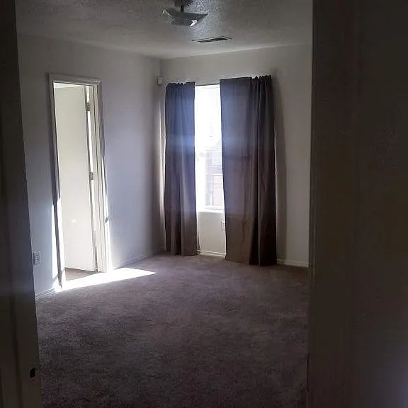 Master bedroom with room darkening curtains to block heat and light