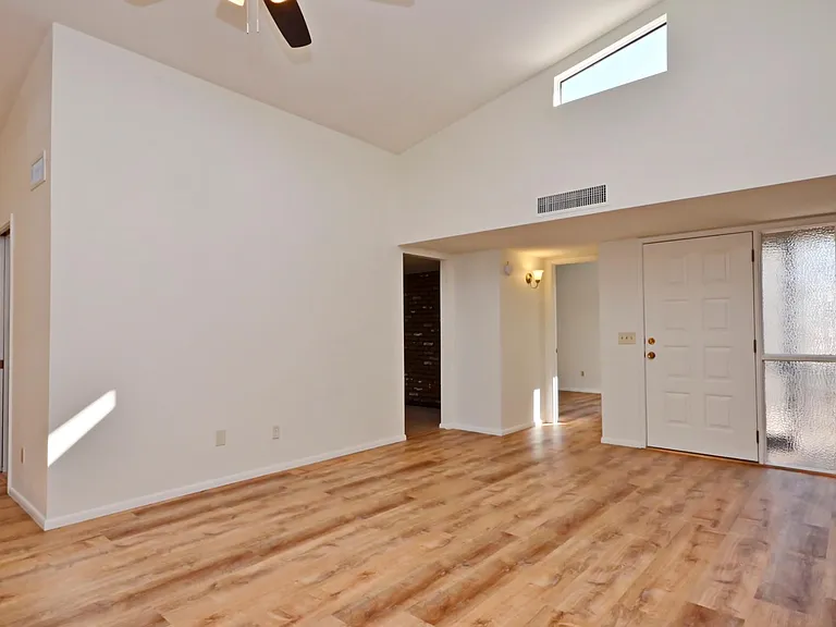 Light and bright living room view to entrance.