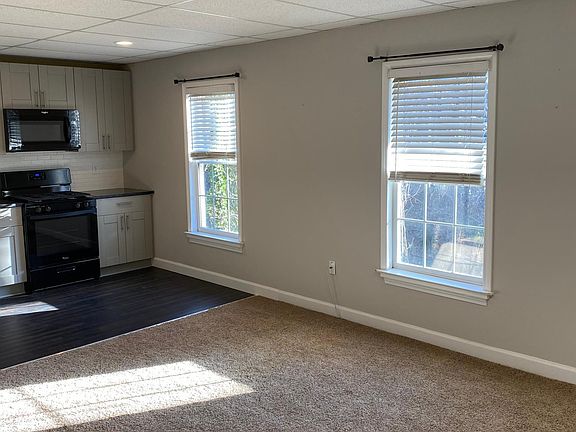 Daylight basement overlooks fenced backyard