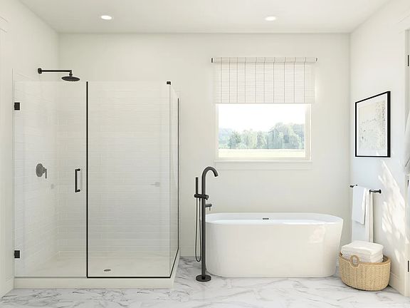 Primary bath with freestanding tub and glass shower enclosure