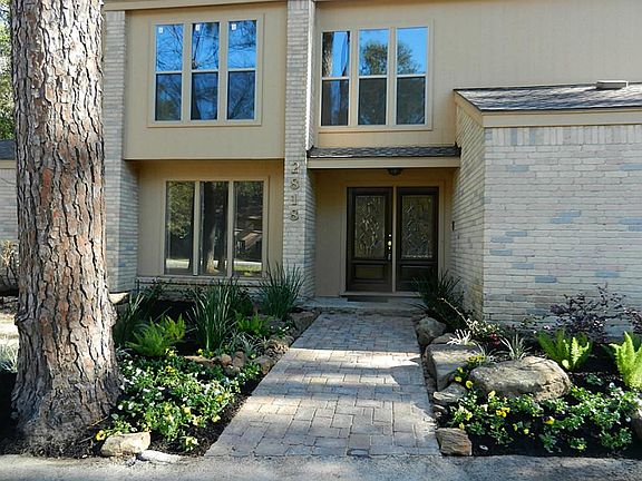 Enjoy the original estates of Kingwood with your private resort style backyard a large pool and green Lush landscaping on over an acre lot.