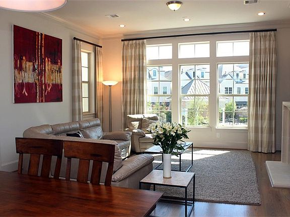 Large open living room with fantastic windows and pool views.