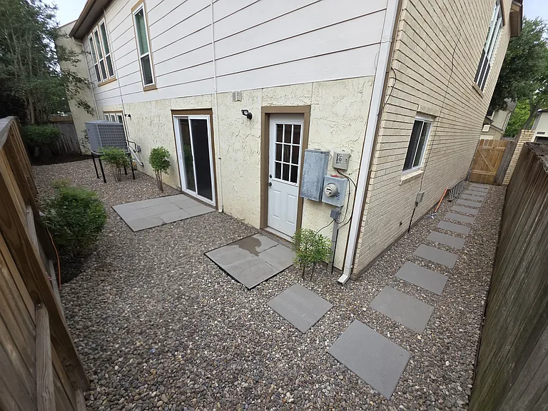Low maintenance hardscape backyard.