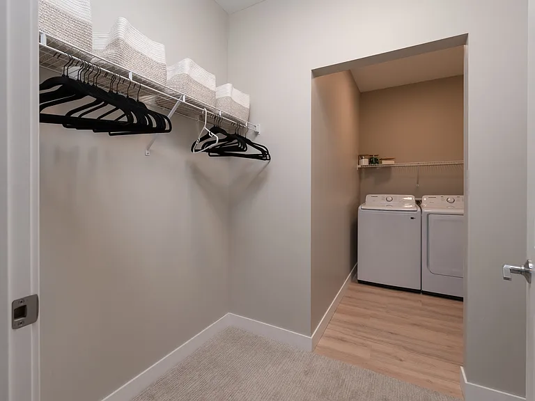 A convenient layout that places storage and laundry within easy reach.