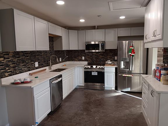 New kitchen flooring, appliances, cabinets and ceiling lights