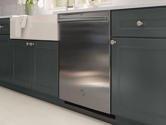Kitchen with white fire-clay apron front sink and stainless appliances