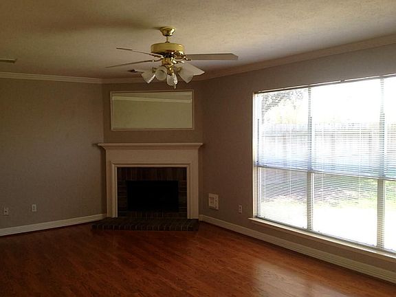 Cheerful and warm both describe this inviting family room. The mirror above the fireplace is fixed i