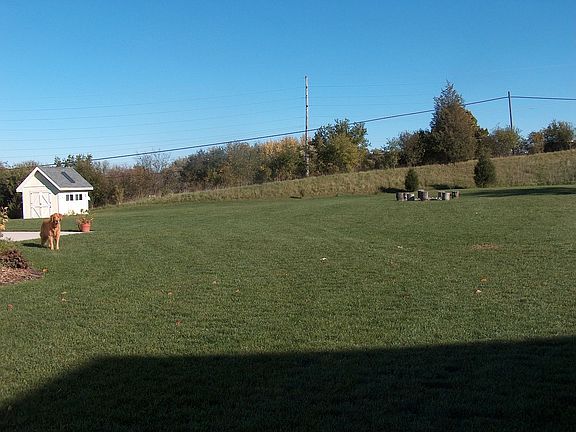 .8 acre with playhouse/garden shed