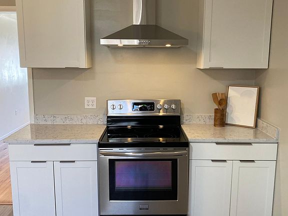 Renovated kitchen with brand new cabinets, granite, and stainless appliances