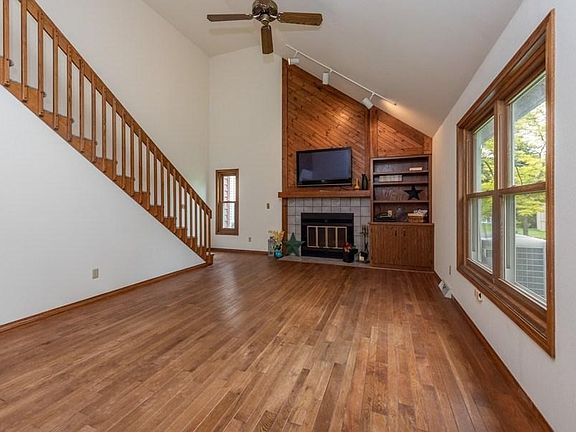 Fireplace. Oak floor. TV stays