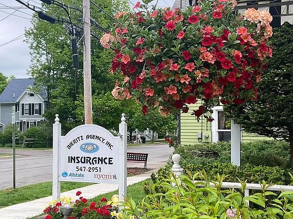 Sign and view down Main St