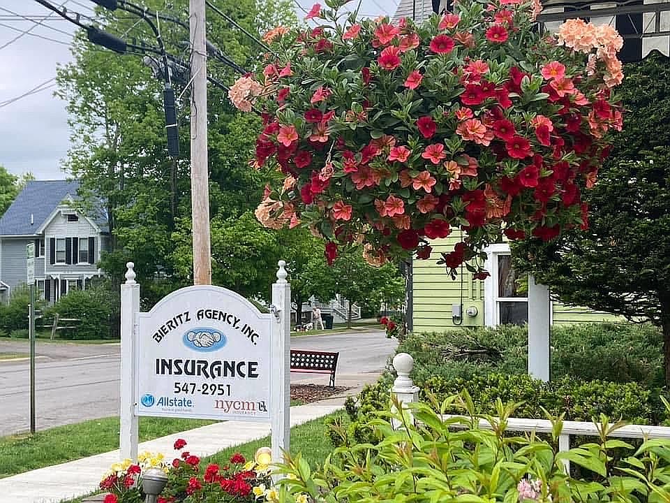 Sign and view down Main St
