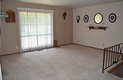 Living room with newer carpet.