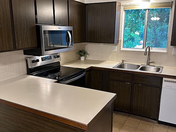 Kitchen with new oven and microwave.