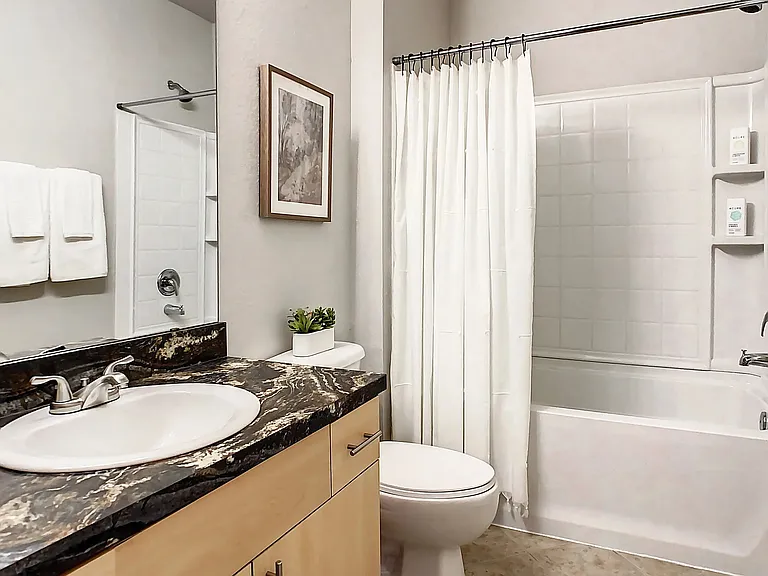 Spacious bathrooms with ample vanity space and immaculate design for comfortable, modern living.