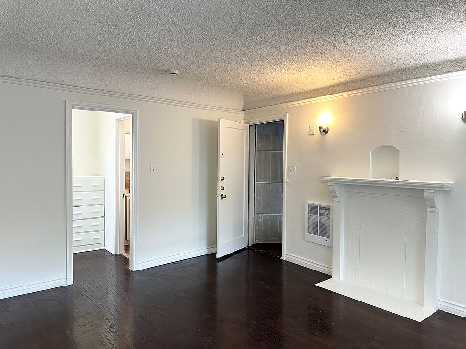 Main Livingspace with decorative fireplace and wood floors