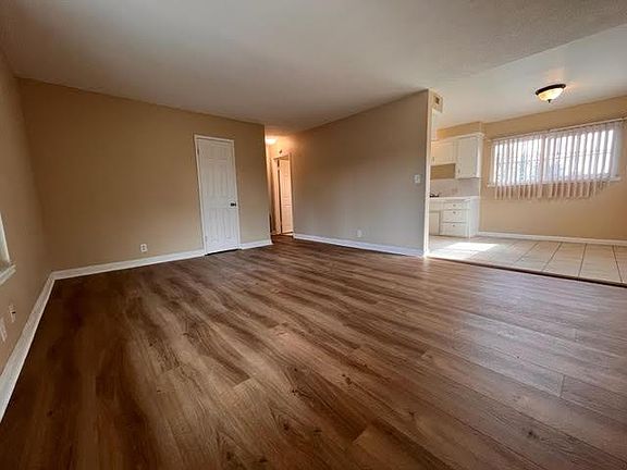 Living Room view to dining area and kitchen