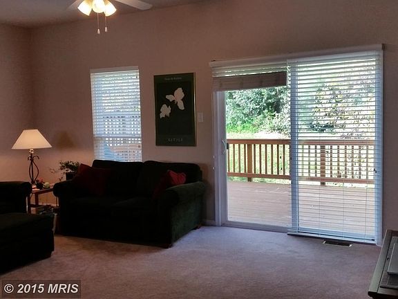 Living Room 19x12 facing back toward trees & deck