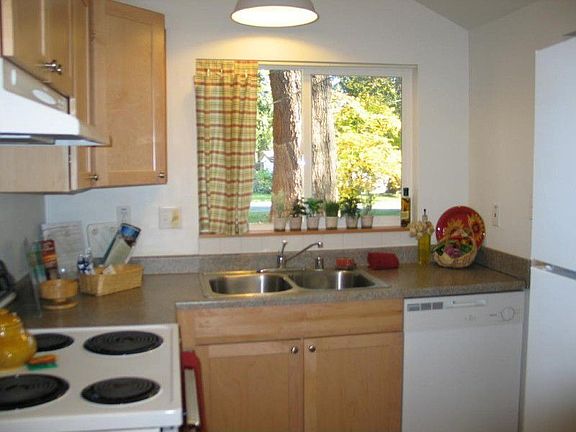 Beautifully updated warm and friendly kitchen with new counters, flooring, and cabinets â?? open, li