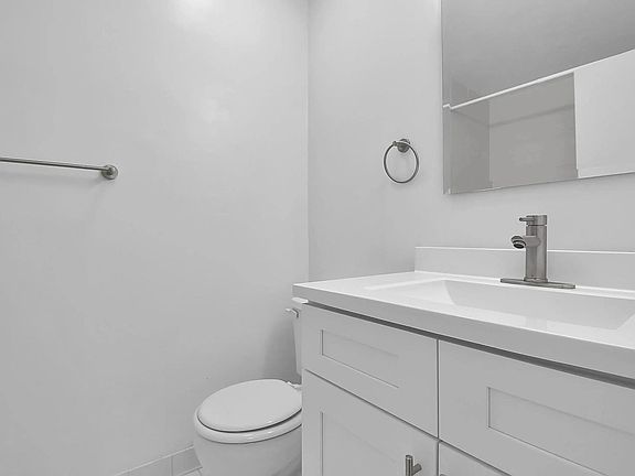 Discover your perfect retreat in this bright and modern bathroom, featuring sleek finishes and a spacious layout designed for comfort and relaxation.
