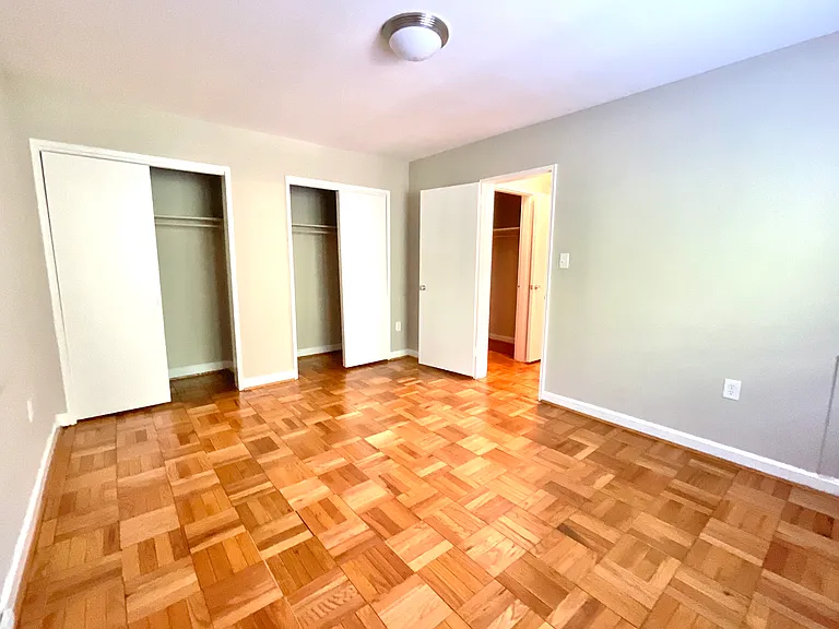 Bedroom looking at two large closets