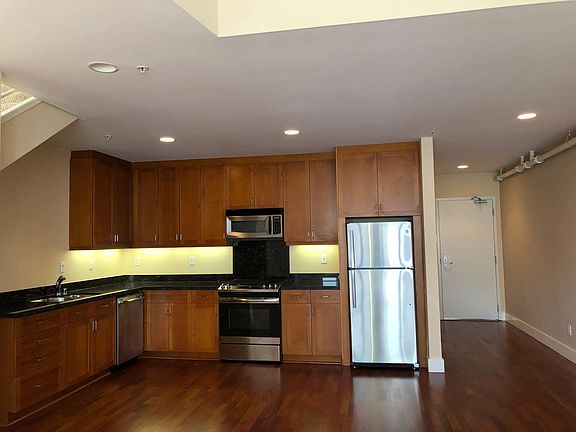 KITCHEN OPENS TO LIVING ROOM - SIMPLY ADD YOUR ISLAND TO CREATE A DIVISION OF SPACE