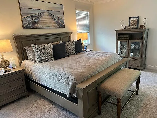 The Master bedroom is spacious with a king-size pillow-top mattress. There is a fireplace tv stand with a 40' smart tv. A walk-in closet including an extra dresser has plenty of space for all your clothes.