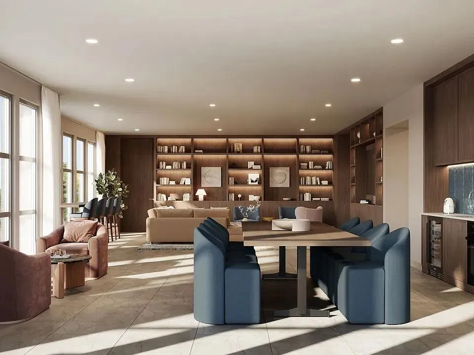 Sky lounge with custom built-ins, communal dining space, and lounge seating arranged for conversation or quiet co-working.