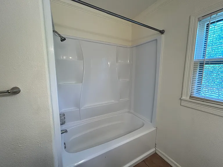 Newly installed tub and shower surround.